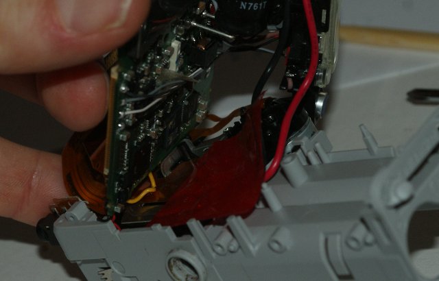 [Image of the partly lifted main board]